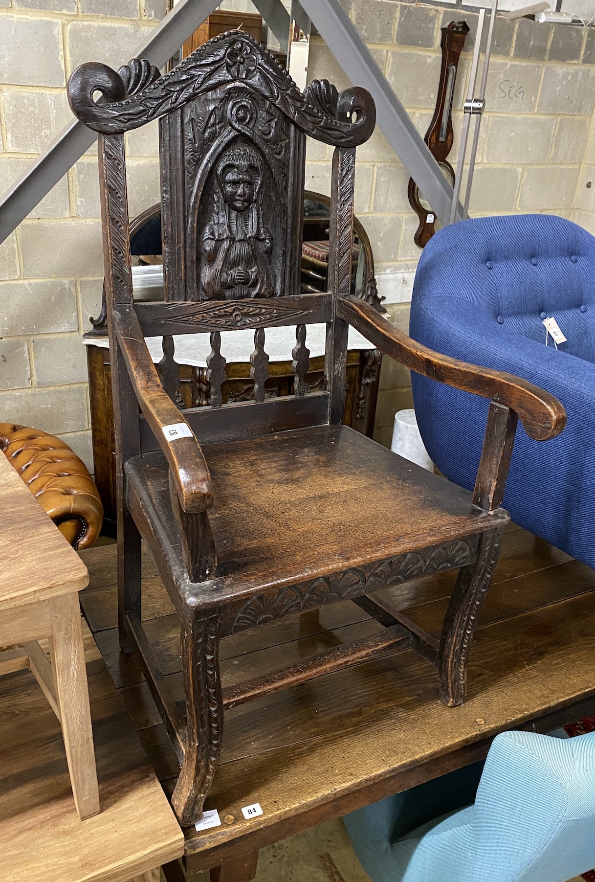 A 17th century style carved oak wainscot chair, width 63cm, depth 56cm, height 117cm